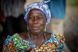 elderly woman smiling at camera in ghana