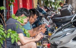 men on their phones in nha trang vietnam